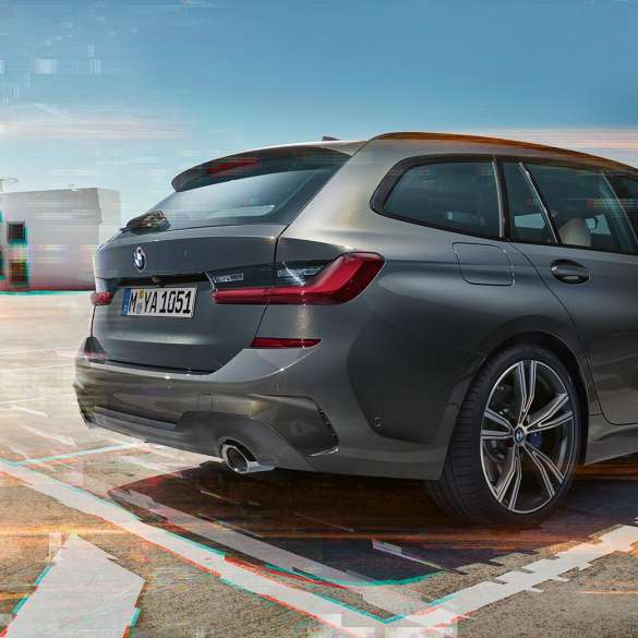 BMW 3 Series Touring, three-quarter rear view on parking lot G21 BMW 3 Series Touring, three-quarter rear view on parking lot in urban environment G21