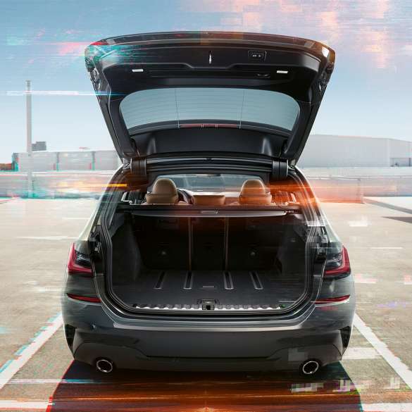 BMW 3 Series Touring, rear shot with open tailgate G21 BMW 3 Series Touring, rear shot with open tailgate on parking lot in urban environment G21