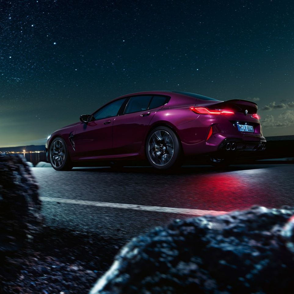 BMW M8 Competition Gran Coupé three-quarter rear view low angle shot F93 BMW M8 Competition Gran Coupé F93 2020 BMW Individual Ametrine metallic three-quarter rear view low angle shot