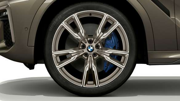 BMW X6 M50i SUV with focus on light alloy wheel BMW X6 M50i SUV exterior with focus on light alloy wheel
