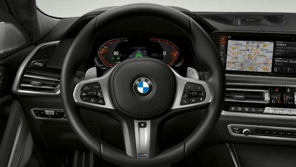 BMW X6 M50i SUV G06 Interior M leather steering wheel Close-up BMW X6 M50i M50d G06 SUV interior M leather steering wheel