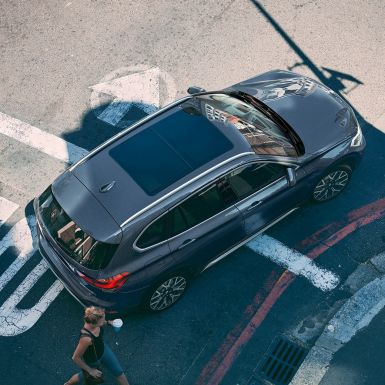 BMW X1 SUV F48, Panorama glass roof. BMW X1 SUV F48, with view of the panorama glas roof from an aerial perspective.