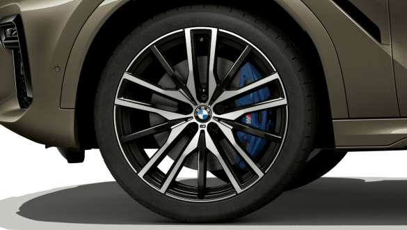 BMW X6 with focus on light alloy wheel SUV G06. BMW X6 exterior with focus on light alloy wheel SUV G06.