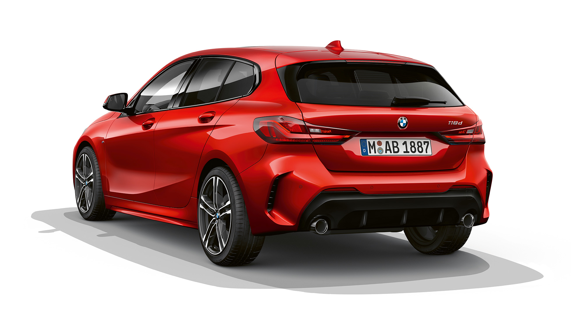 BMW 1 Series Model M Sport, three-quarter rear F40. BMW 1 Series Model M Sport in Melbourne Red metallic, studio shot three-quarter rear F40.