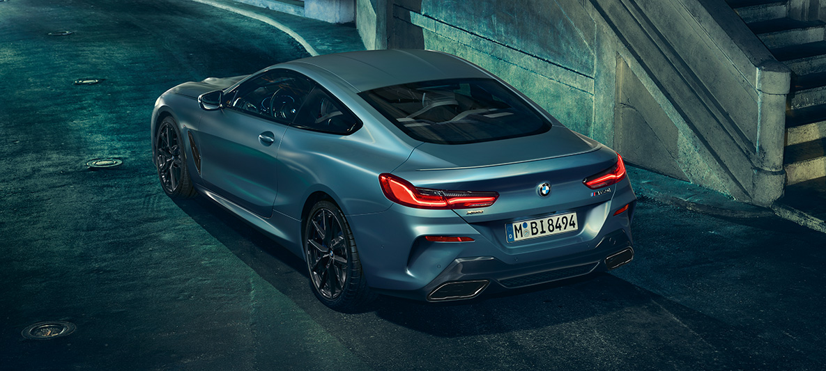 The BMW M850i Coupé First Edition, three-quarters rear A three-quarter rear still shot of the BMW M850i Coupé First Edition in an urban setting.