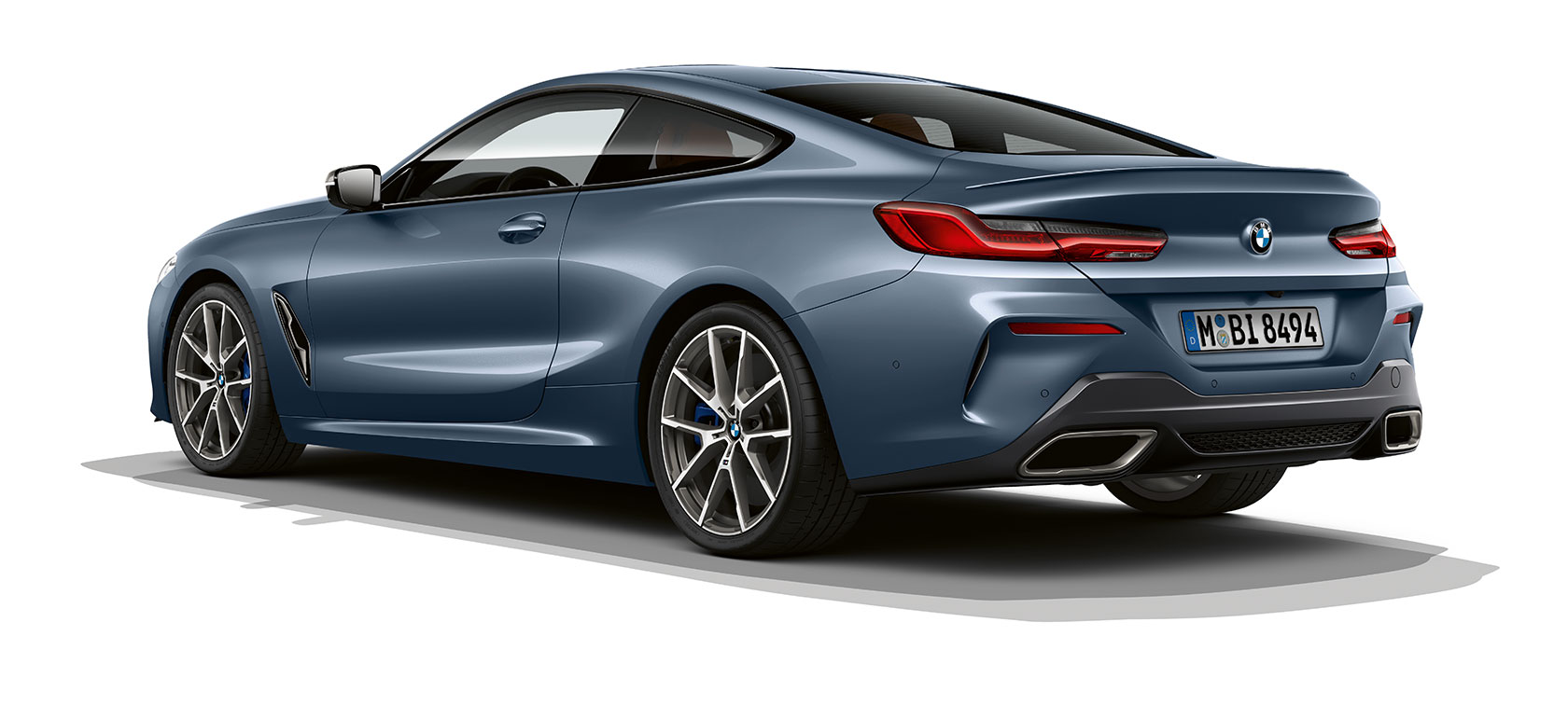 BMW 8er Coupé, Barcelona Blue metallic G15. BMW 8er Coupé, Barcelona Blue metallic, three-quarter rear view G15.