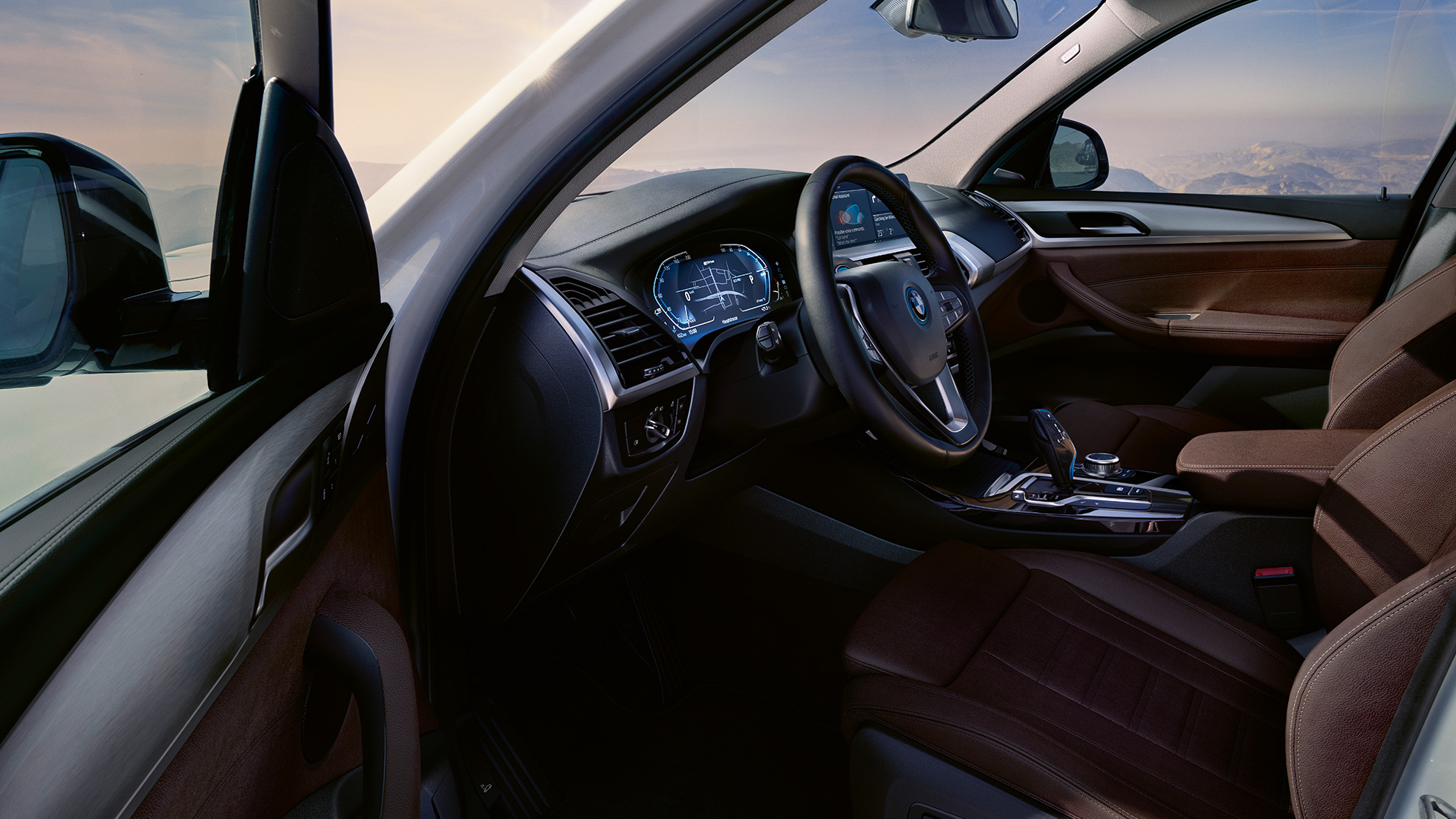 문이 열린 BMW iX3 G08의 콕핏 문이 열린 BMW iX3 G08 2020 미네랄 화이트 메탈릭의 콕핏